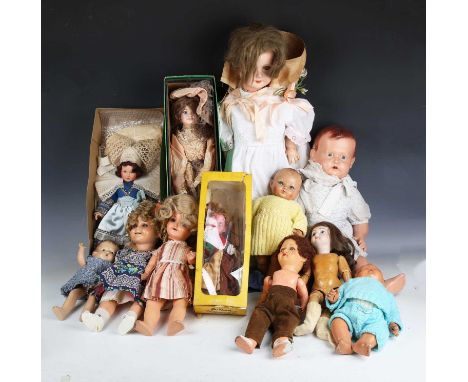 A German Shirley Temple composition doll with curly wig, sleeping blue eyes and open mouth showing upper teeth, height 40cm (
