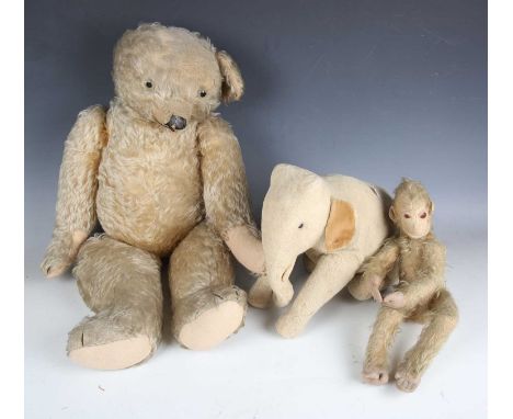 A Merrythought mohair humpback teddy bear with button in left ear, black and white eyes, vertically stitched snout and jointe