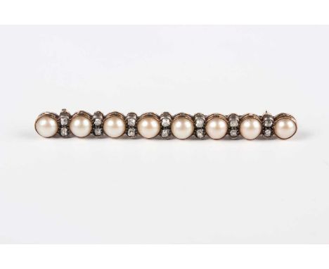 A gold backed, silver set, diamond and half-pearl bar brooch, mounted with a row of half-pearls alternating with seven pairs 