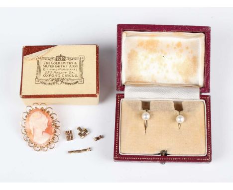 A 9ct gold mounted oval cameo brooch, carved as a bust portrait of a young lady within a circular and beaded surround, width 