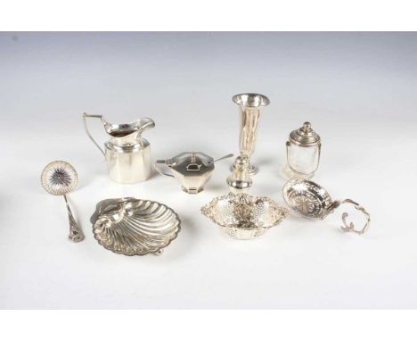 A small group of silver, including a cream jug, London 1933 by Vander &amp; Hedges, height 9.5cm, a butter shell on ball feet
