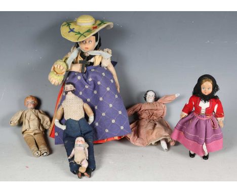 A German porcelain head and shoulders doll with painted and moulded features, height 15cm (paint wear and lacking feet), toge