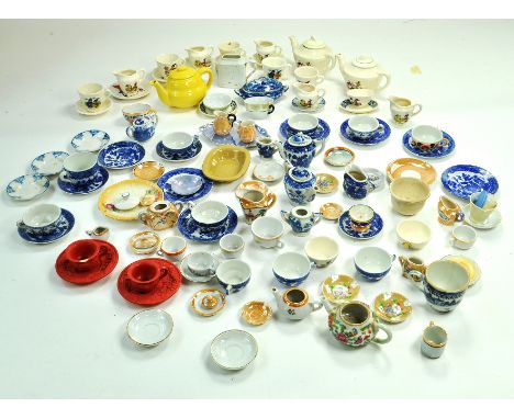 An attractive large group of Dolls House Tea Service related items, mid 20th century, mostly china or ceramic based including