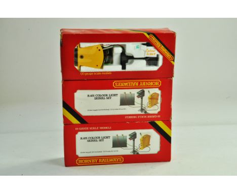 Hornby 00 model railway issues comprising older issue trio of Colour Light Signal Sets. Generally very good to excellent in s