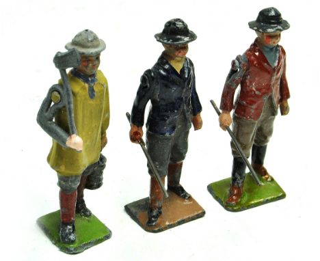 Britains trio of early lead metal issues comprising No. 558 village boy with stick x 2 plus improvised shepherd boy with axe.