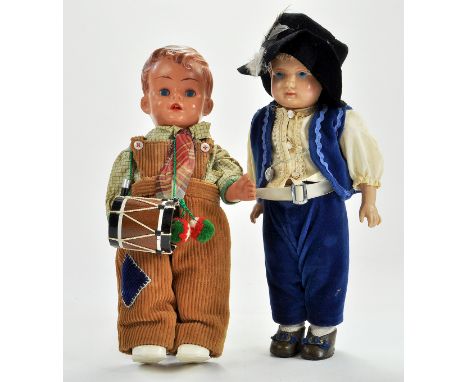 A French Celluloid/hard Plastic 12” Doll circa 1930-40’s. Moulded hair, painted face, blue Intaglio eyes, wearing velveteen t