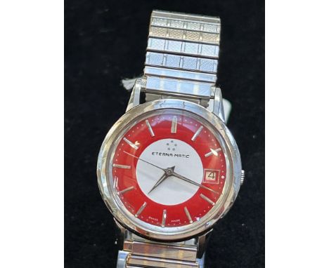 Eterna matic vintage wristwatch, date app at 3 o' clock, red & white face with silvers batons. Currently ticking & keeping go