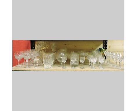 A shelf of 19th century and later glassware, to include cut glass tumblers