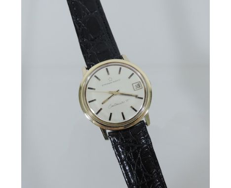 A gentleman's Eterna-matic Centenaire '71' two colour wristwatch, on a black leather strap, boxed
