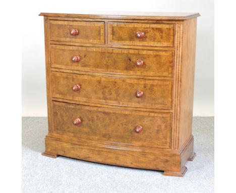 A Frank Hudson Ltd oak and walnut bow front chest of drawers, 103cm