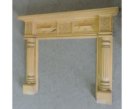 A modern carved stained pine fire surround, 160cm