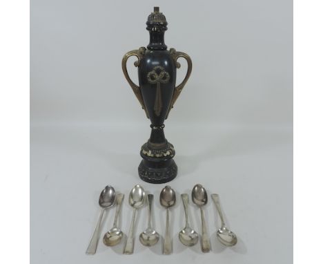 A set of eight Cunard Line silver plated dessert spoons, together with an ebonised and gilt metal mounted table lamp