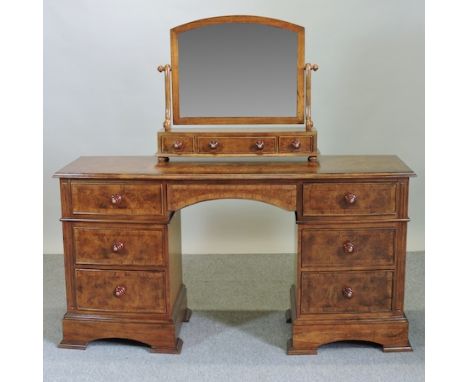 A Frank Hudson Ltd oak and walnut crossbanded bow front dressing table, 153cm, together with a matching swing frame toiletry 