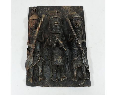 A Benin style bronze plaque, decorated with tribal figures, 30 x 23cm