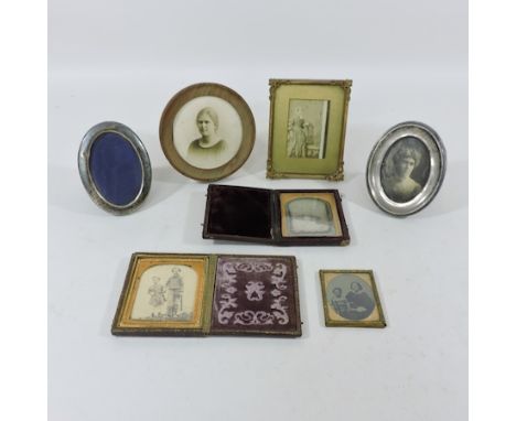 A collection of Victorian portrait miniatures, to include two daguerrotypes and two silver frames, 11cm tall