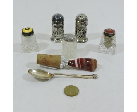A pair of early 20th century pierced silver peppers, 6cm tall, together with a pair of enamel top condiments and other items