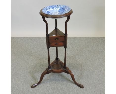 A George III mahogany tripod washstand, 55cm, with a Copeland blue and white wash bowl