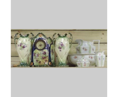 An early 20th century Staffordshire jug and bowl set, together with a pottery clock garniture and a 1970's Kathie Winkle Broa