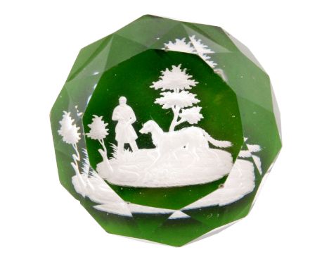 A 19th Century French paperweight probably by Baccarat decorated with a sulphide of a huntsman and his dog on green ground, w