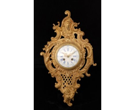 A late 19th Century gilt metal French Cartel wall clock with eight day striking movement and blue and white enamelled dial wi