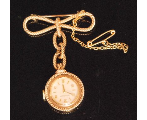 A 1950s hallmarked 9ct lady's Jaeger Le Coultre manual wind pendant fob watch, circular white enamel dial with gilt metal Ara