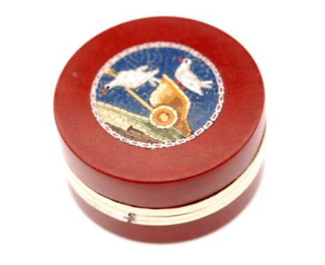 An early to mid 19th Century micromosaic circular pill or patch box, the red purpurine glass circular pull off cover inset wi