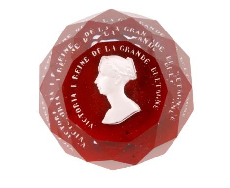 A 19th Century French paperweight probably by Baccarat decorated with a sulphide of a Queen Victorian on a red ground, width 