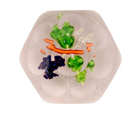 A 19th Century French paperweight by St Louis decorated with lamp work fruit of grapes on vine,  the dome multifaceted above 