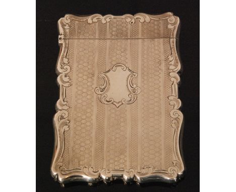 A Victorian hallmarked silver card case of shaped rectangular outline with engine turned decoration and scrolled borders, wei