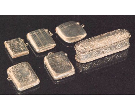 Five various hallmarked silver vesta cases, three foliate engraved, two with engine turned decoration, together with a shaped