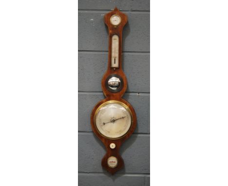 A George III line inlaid mahogany wheel barometer incorporating dry/damp dial, thermometer and spirit level, height 94cm 