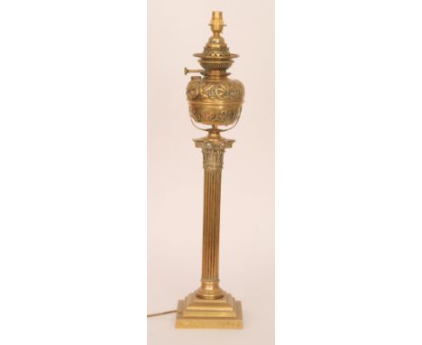 A large Victorian brass Corinthian column oil lamp with leaf cased reservoir in classical column and stepped base, height 68c