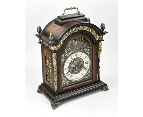 German walnut table clock with brass. Second half of the 20th century. Mechanical movement with Westminster quarter strike on