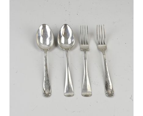 Four silver cutlery parts, 833/000, a spoon and fork with a hammered decor, MT.: H.Hooijkaas, Schoonhoven, jl.: P:1950 and a 