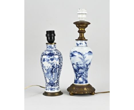 Two 18th - 19th century Chinese porcelain lamp bases with landscape decor + figure in landscape decor. One hairline. Dimensio