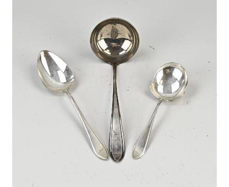 Three silver serving spoons, 833/000, model pointed fillet with a potato spoon, a vegetable spoon and a soup life. MT.: potat