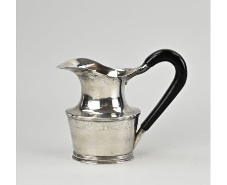 Antique silver jug, 18th century, oval model, on an oval ring with filet edges and with an ebony handle. The jug has 2 bands 