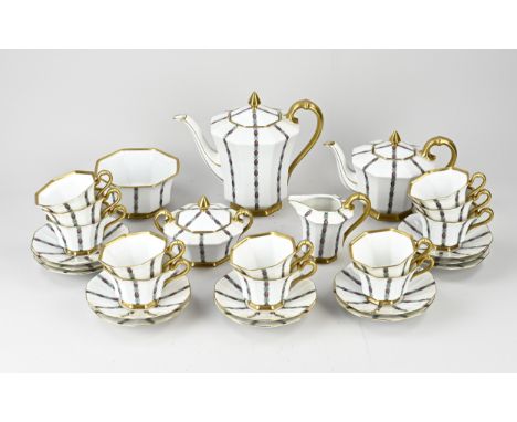 Beautiful antique German Tirschenreuth Bavaria porcelain tea set with floral/gold decor. Octagonal. Circa 1920. Consisting of