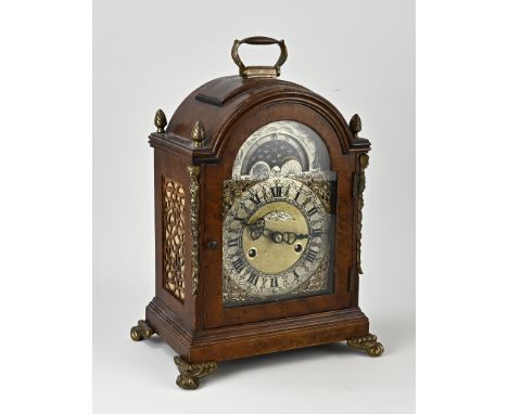 English burr walnut table clock with moon phase and half hour striking. Weekly runner + brass decorations. 20th century. One 