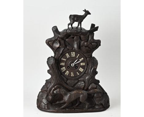 Antique Schwarzwalder table clock with series kit and hunting dog. Later fitted with a French mantel clock. Eight-day movemen