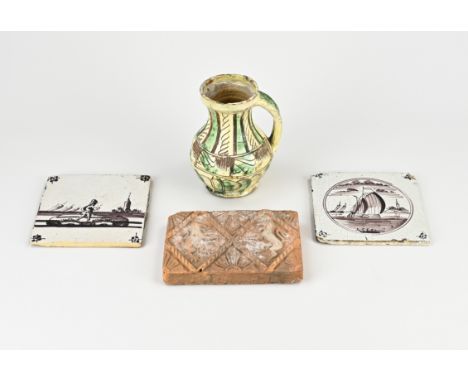 Four parts antique pottery. Consisting of: 17th - 18th century jug with green/yellow glaze. A terracotta stove tile 1598, and