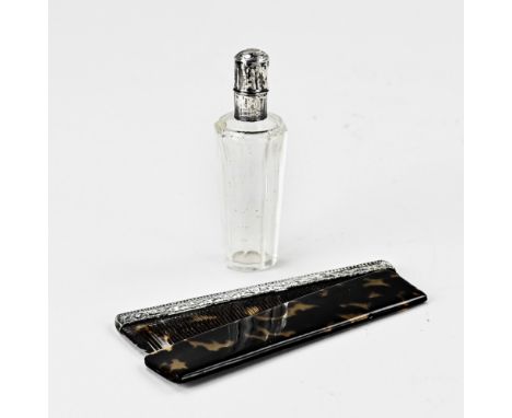 Celluloid comb with a silver rim, 10 cm, and a crystal perfume bottle with silver collar and cap, decorated with engraving. T