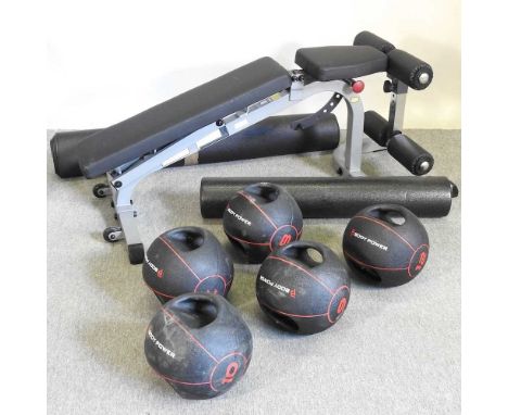 A Body Solid gym bench, together with five Body Power weights, a foam roller and mat