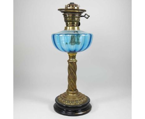 An oil lamp, with a blue glass reservoir, 44cm high