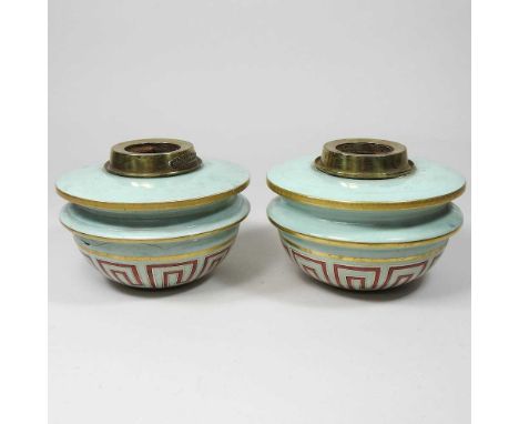 A pair of opaque green glass and gilt painted oil lamp fonts, 15cm dia (2)