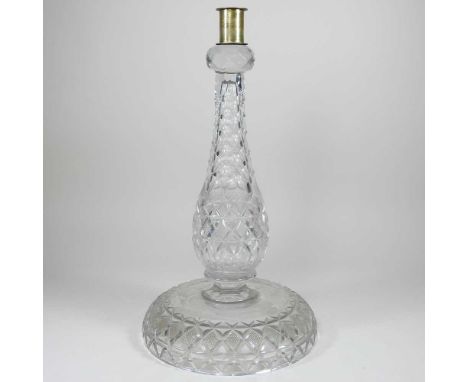 A cut glass oil lamp base, 42cm highDirty. Heavy and well made. There is a brass collar on the top, but no other fittings. Ge