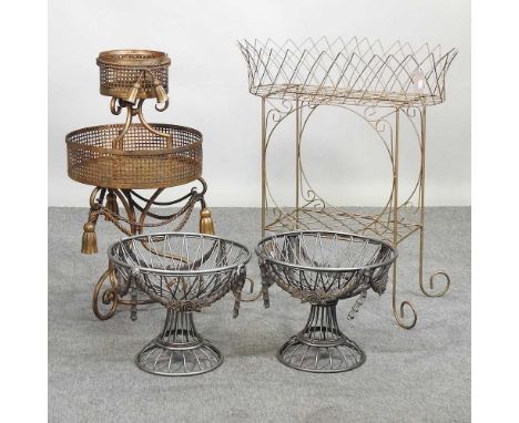 A gilt painted metal two tier stand, with ropetwist decoration, 81cm high, together with another gilt painted stand and a pai