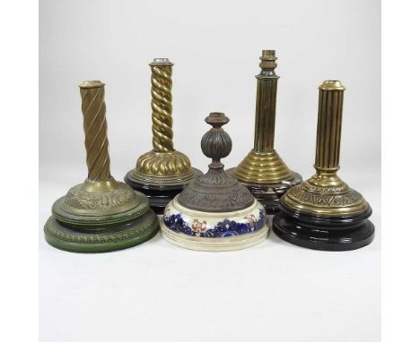 A collection of brass oil lamp bases, highest 30cm