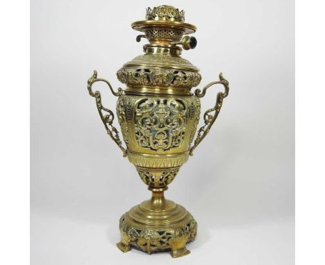 An ornate brass oil lamp base, 42cm high
