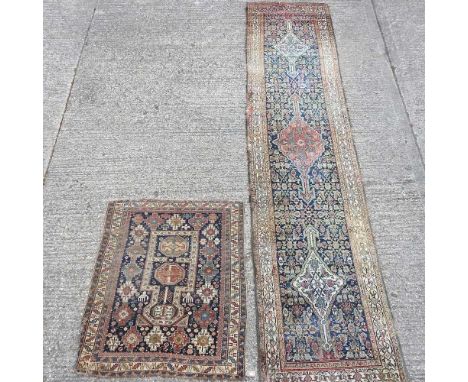 A Persian woollen runner, with three central medallions, on a blue ground, 440 x 98cm, together with a prayer rug (2)Overall 